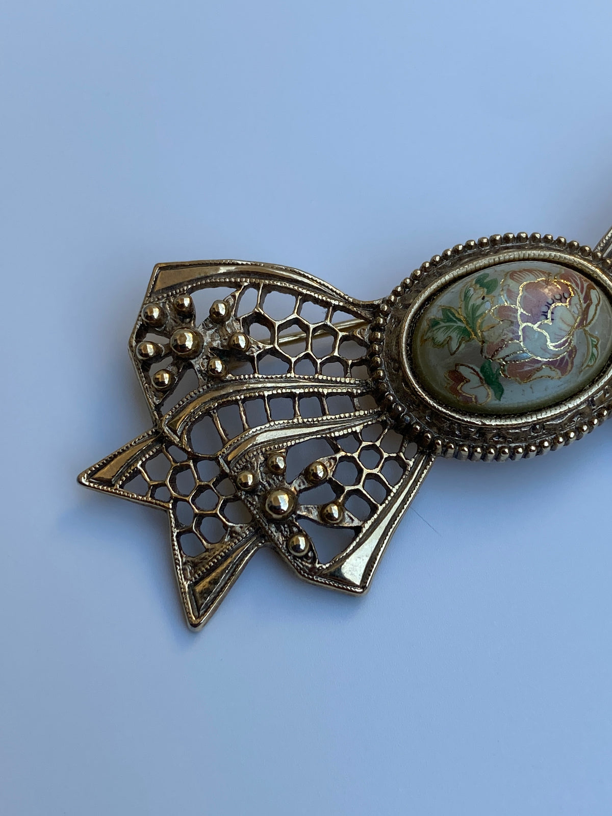 Vintage Victorian Revival Gold Tone Filigree Bow Brooch with Floral Cabochon Vintage Victorian Revival Gold Tone Filigree Bow Brooch with Floral Cabochon