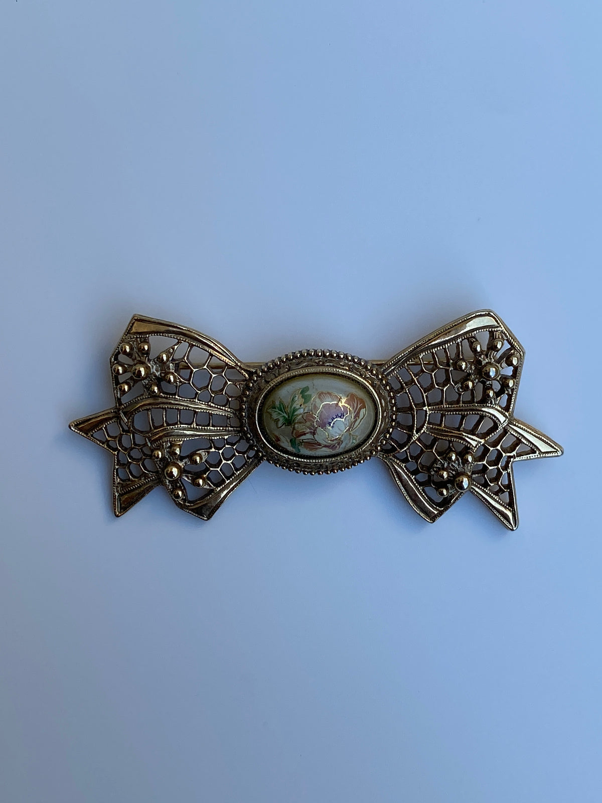 Vintage Victorian Revival Gold Tone Filigree Bow Brooch with Floral Cabochon Vintage Victorian Revival Gold Tone Filigree Bow Brooch with Floral Cabochon