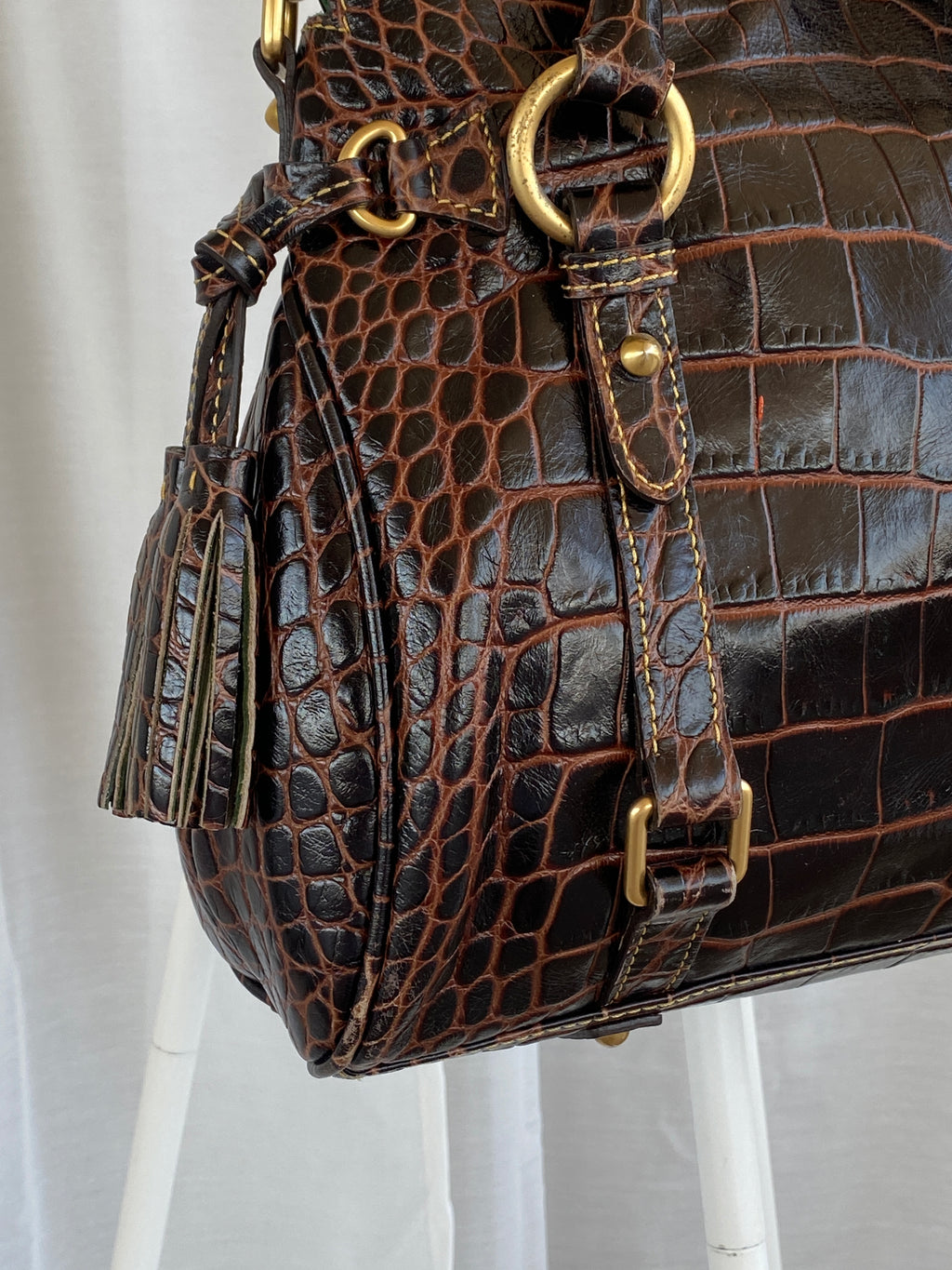 Dooney & Bourke Brown Croc Print Designer Hand Bag with Side Tassels and Gold Details
