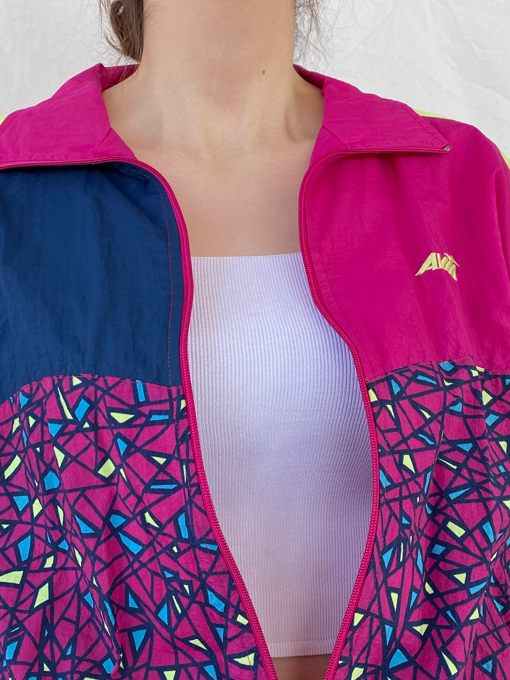 جاكيت رياضي نسائي من Avia بتصميم هندسي باللون الوردي والأصفر - مقاس صغير