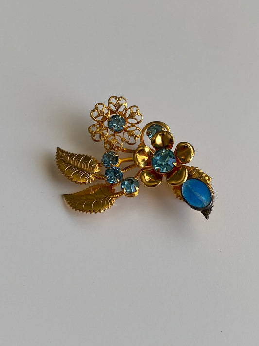 Vintage Gold Tone Blue Rhinestone Floral Spray Brooch with Cabochon Accent Pin