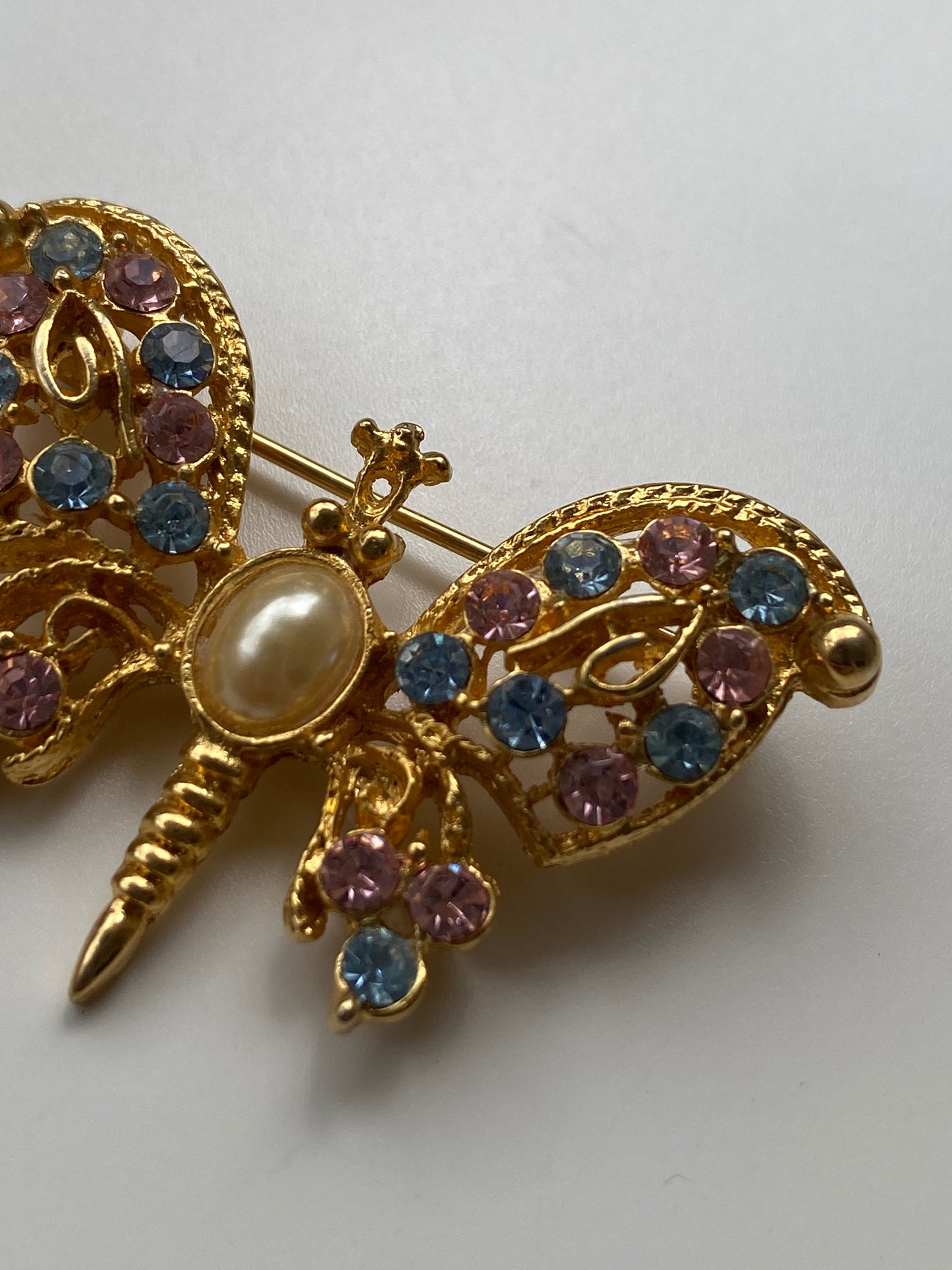 Vintage 80s–90s Olia Gold Filigree Butterfly Brooch with Pink & Blue Rhinestones and Pearl Centre