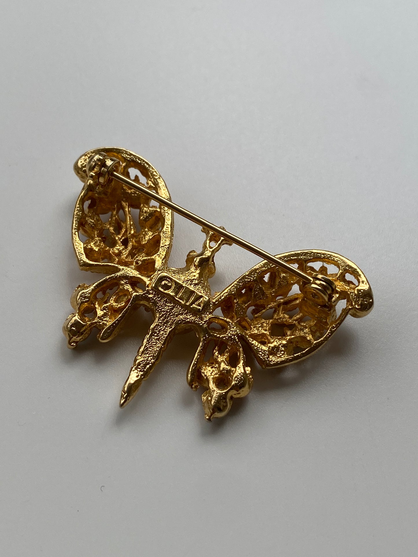 Vintage 80s–90s Olia Gold Filigree Butterfly Brooch with Pink & Blue Rhinestones and Pearl Centre