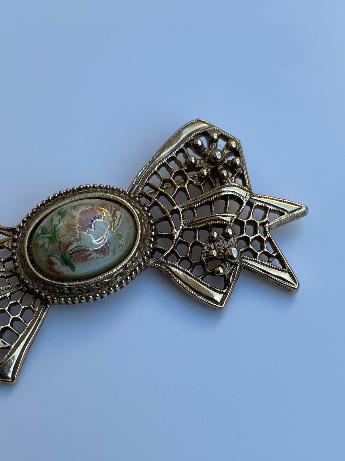 Vintage Victorian Revival Gold Tone Filigree Bow Brooch with Floral Cabochon Vintage Victorian Revival Gold Tone Filigree Bow Brooch with Floral Cabochon