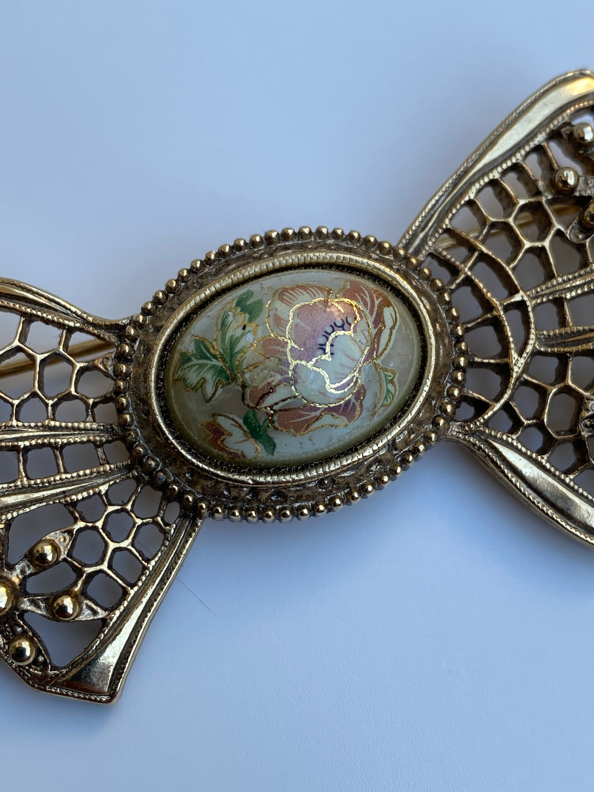Vintage Victorian Revival Gold Tone Filigree Bow Brooch with Floral Cabochon Vintage Victorian Revival Gold Tone Filigree Bow Brooch with Floral Cabochon